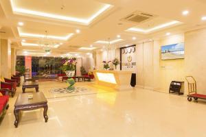 a lobby of a hotel with a table and chairs at Regalia Nha Trang in Nha Trang
