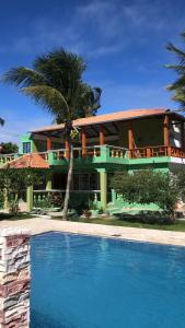 a house with a swimming pool in front of it at Villa La Esperanza 