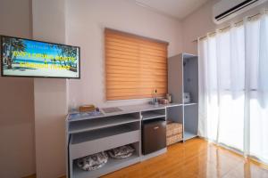 TV a/nebo společenská místnost v ubytování SMAK's Hotel