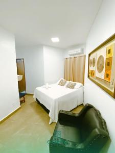 Postel nebo postele na pokoji v ubytování O Canto Pousada