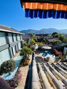 a view from the balcony of a resort at 玉龙白沙普宿客栈 in Lijiang