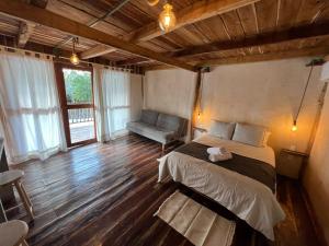 Postel nebo postele na pokoji v ubytování Xa am Natural Lodgement