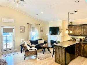 a living room with a couch and a table at Suites On King in Niagara-on-the-Lake