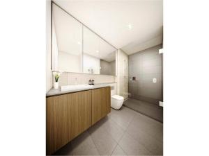 a bathroom with a sink and a toilet at Riverside Resort Apartment in Melbourne