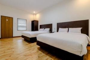 Katil atau katil-katil dalam bilik di Hotel Sumaryo