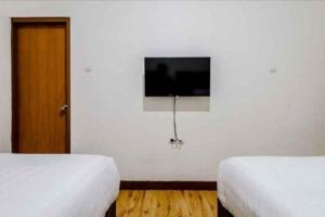 Katil atau katil-katil dalam bilik di Hotel Sumaryo
