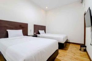 Katil atau katil-katil dalam bilik di Hotel Sumaryo