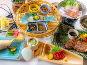 a table with plates of food on it at Yumotoya in Matsumoto