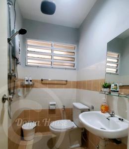 a bathroom with a toilet and a sink at Doma House Alpine at Lost World of Tambun in Tambun