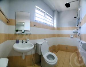 a bathroom with a toilet and a sink at Doma House Alpine at Lost World of Tambun in Tambun