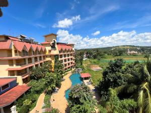 an aerial view of a hotel with a resort at Acron Candolim Regina in Candolim