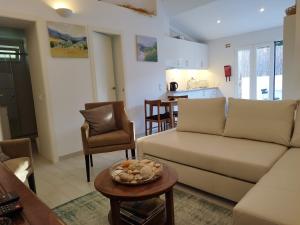 a living room with a couch and a table at 20 Casa da Aldeia in Alfarim