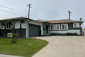 a house with a garage and a driveway at SPACE X ,LAX & Beaches Beautiful Guest House in Gardena