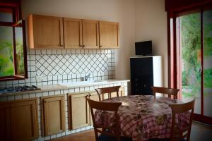 Kuchyň nebo kuchyňský kout v ubytování Residence Arenella