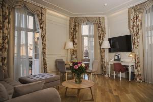 a living room with a vase of flowers on a table at Corinne Art & Boutique Hotel in Istanbul