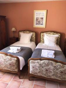 Postel nebo postele na pokoji v ubytování Hotel L'Oustau de la Font