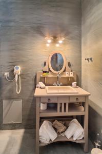 A bathroom at Haones Suites Még 31 kép