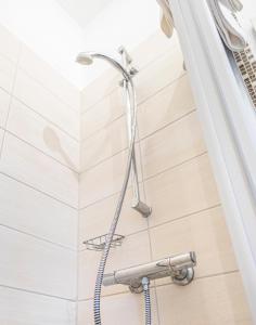 a shower in a bathroom with a shower head at Weisses Rössl in Pfreimd