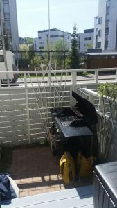 a balcony with a piano on top of a fence at Spacious super located Lahti apartment in Lahti