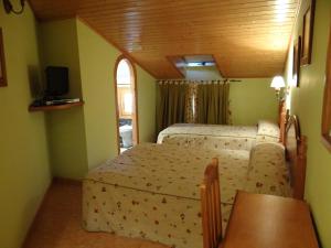 Телевизор и/или развлекательный центр в Hotel Casa Carmen