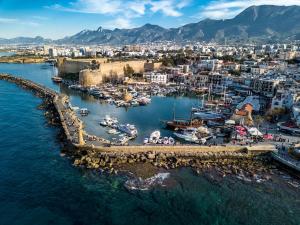 an aerial view of a harbor with boats in the water at Homelike Guest house in Kyrenia