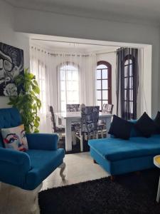 a living room with two blue couches and a table at cozy 2 bedroom apartment in Sharm El Sheikh