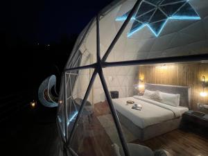 Letto o letti in una camera di GLAMPING CLUB