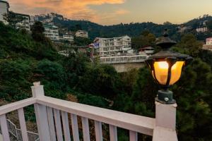 a street light sitting on the side of a balcony at Meraki shimla in Shimla