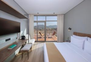 Hatta Resorts客房内的一张或多张床位