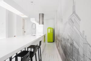 a kitchen with black chairs and a green refrigerator at Vakantiehuis Juliette in Diksmuide +17 photos