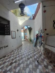 a hallway of a building with a tiled floor at Fighting Kangaroo Camp in Dahab