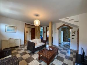 a living room with a couch and a table at Gioco in San Vincenzo +11 photos