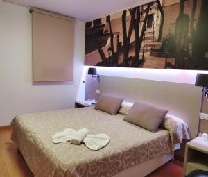 Postel nebo postele na pokoji v ubytování Hello Villarreal Suites