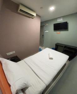 Letto o letti in una camera di Red Orange Hotel Klang - 5 min to Klang Town