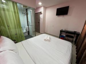Letto o letti in una camera di Red Orange Hotel Klang - 5 min to Klang Town
