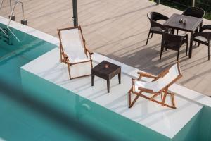 The swimming pool at or close to Serenity Suites Sea View Houses