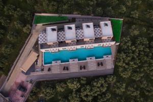 an overhead view of a building with a pool at Serenity Suites Sea View Houses - Happy Rentals in Káto Xirokhórion