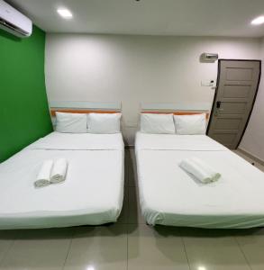Letto o letti in una camera di Red Orange Hotel Klang - 5 min to Klang Town