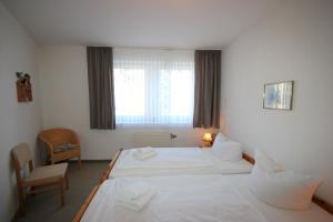 Ein Bett oder Betten in einem Zimmer der Unterkunft Haus Anna by Rujana