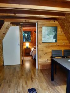 a room with a room with a bed and a door at La Petite Motte in Ceton