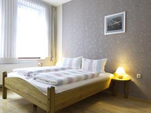 Postel nebo postele na pokoji v ubytování Ferienwohnungen Lassen in Maasholm