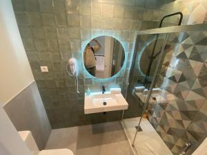 a bathroom with a sink and a mirror at Apartamentos Sol Madrid in Madrid