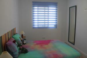 A bed or beds in a room at Luminoso y reformado apartamento en Nerja