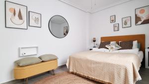 A bed or beds in a room at Apartamento Torre Buena Vista