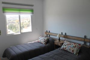 A bed or beds in a room at Luminoso y reformado apartamento en Nerja