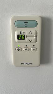 a remote control on the wall of a room at Lovely Apartment Sevilla Azahar Parking in Bormujos
