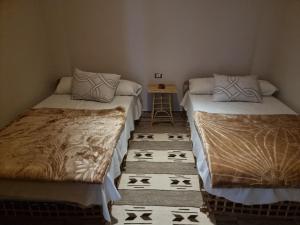Postel nebo postele na pokoji v ubytování SEMIRAmis Siwa