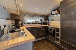 a kitchen with a sink and a counter top at Chalet Young & Fun in Freyung