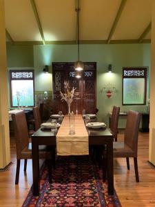 a dining room with a table and chairs at Sala Boutique Hotel in Male City