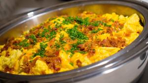 a pot of food with meat and vegetables in it at Hyatt House Naples 5th Avenue in Naples